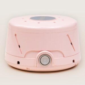 Front view of Dohm Classic in pastel pink showcasing front power dial and angled vent slots on a beige background