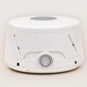Three-quarter front view of Dohm Classic fan-based white noise machine showcasing side vents and central power dial on a light background