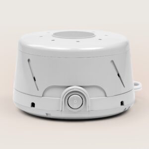 Front view of Dohm Classic white noise machine showcasing front power dial and side air vents on a light neutral background