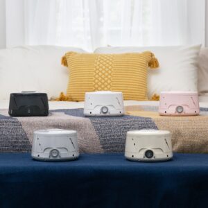 Front view of Dohm Classic sound machine and included gray travel case showcasing power dial on pale beige background