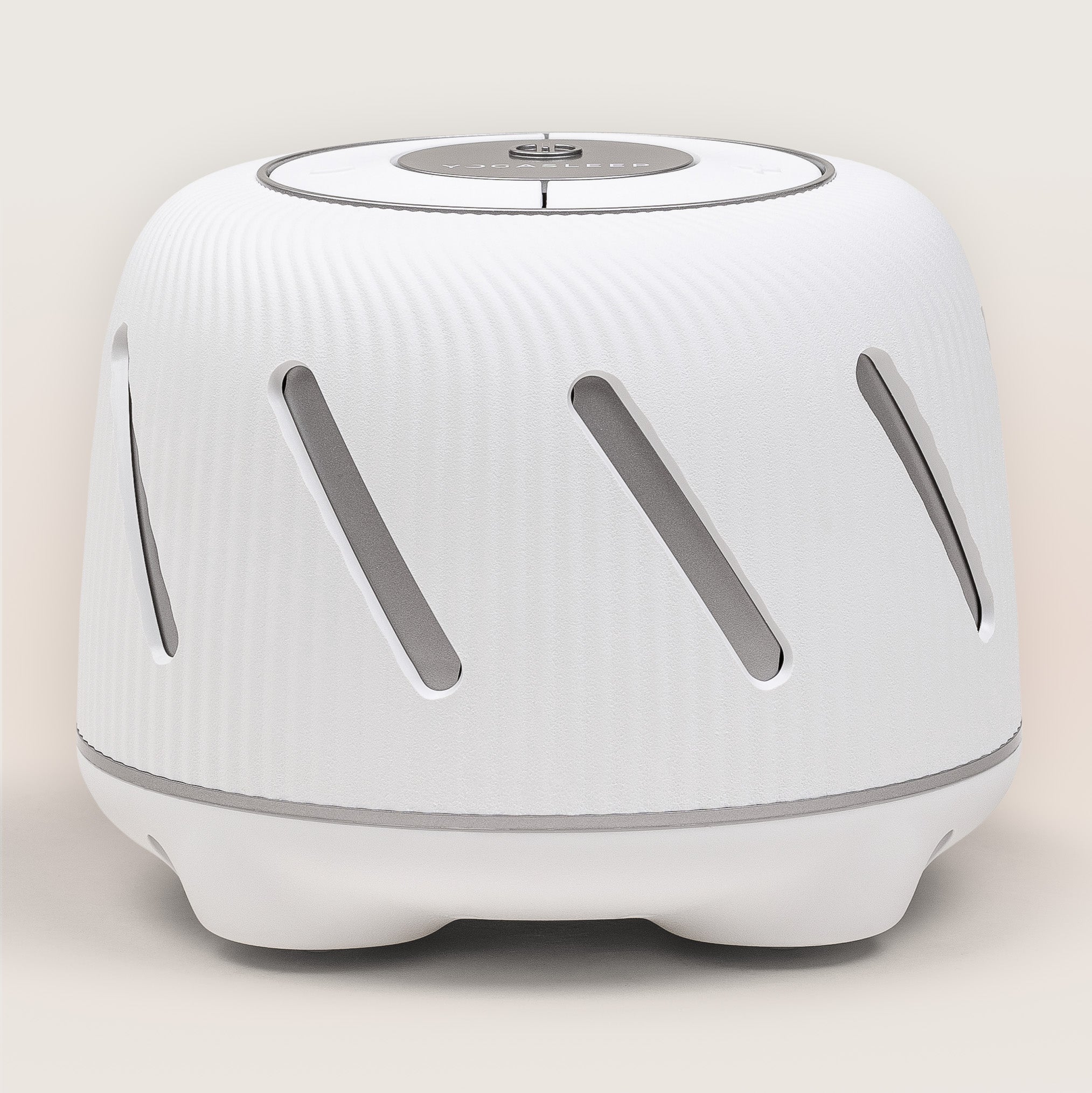 Front view of Dohm Connect sound machine showcasing white housing and gray ventilation slots with a neutral background