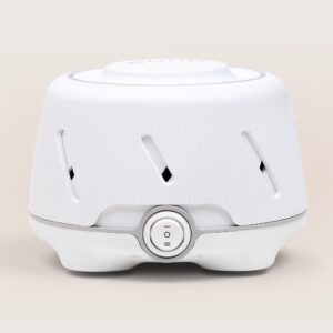 Front view of Dohm white noise machine showcasing ribbed white housing and center two-speed power switch on a soft beige background