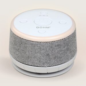 Three-quarter view of Dohm Nova sound machine with fabric-wrapped sides, top controls, and soft light ring