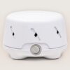 Front view of Dohm Uno white noise machine showcasing single dial power switch and ventilation slots on neutral background