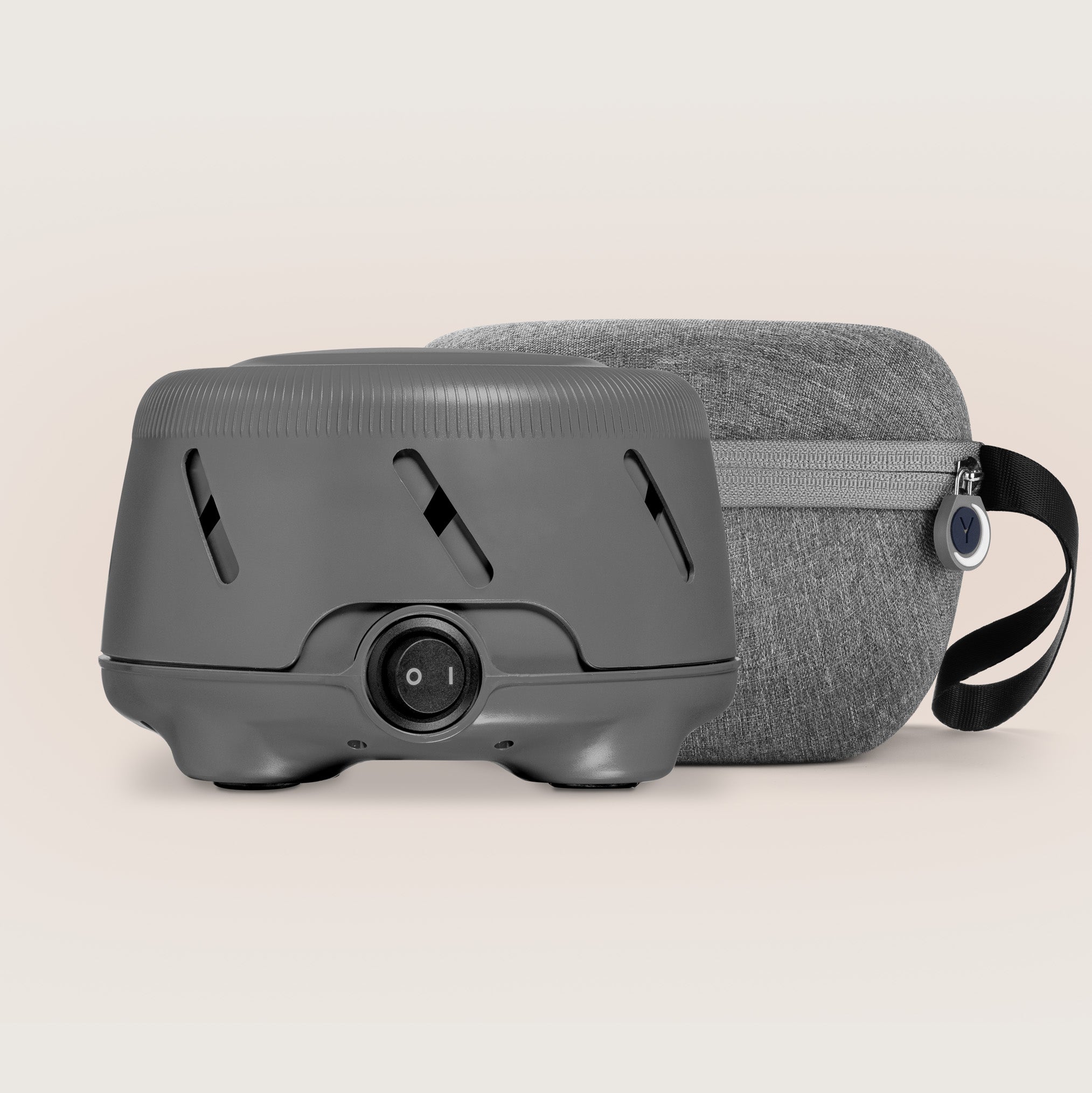Front view of Dohm Uno and protective travel case showcasing the device power switch and zippered fabric case on a neutral background