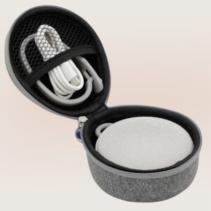 Top view of Hushh 2 in open gray travel case with coiled cable in mesh pocket on pale beige background