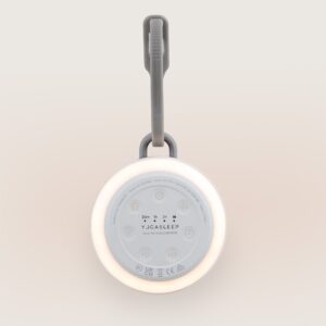 Top-down view of Hushh 2 showing illuminated ring night light, top control buttons, and hanging strap on a neutral background