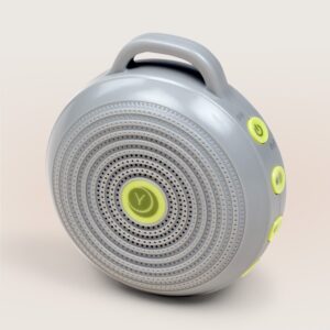 Three-quarter view of Hushh portable sound machine with circular grille, handle, and lime-green control buttons on a pale background
