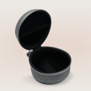 Angled view of travel case open showing interior mesh pocket and elastic strap with light gradient background