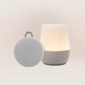 Front view of Duet and Hushh 2 bundle showing lit Duet lamp and Hushh 2 portable round speaker with loop on beige background